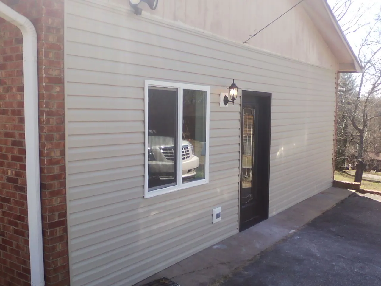 New vinyl siding and entry door on a room addition in Chillicothe